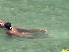 Horny couple is fucking on the beach thinking that no one is...